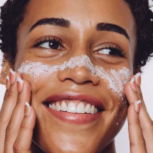 Woman cleansing her face with CellDerma skincare cleanser