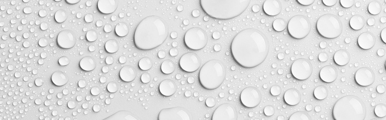 Water droplets on a grey background