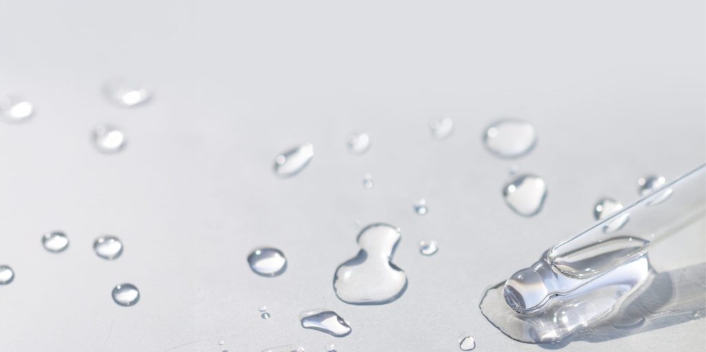 water serum pipette on grey surface