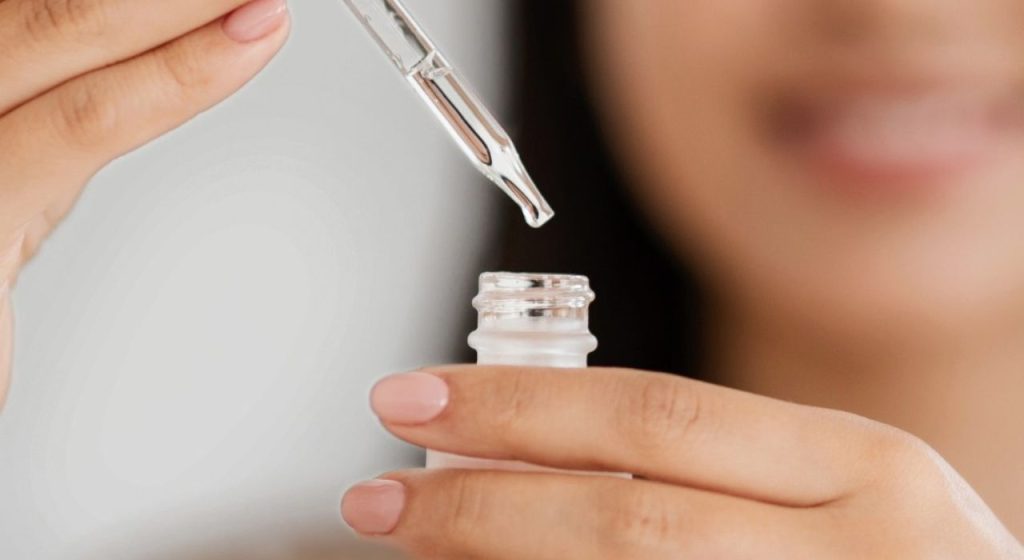 CellDerma Serum Bottle Pipette Woman Close Up Content Image