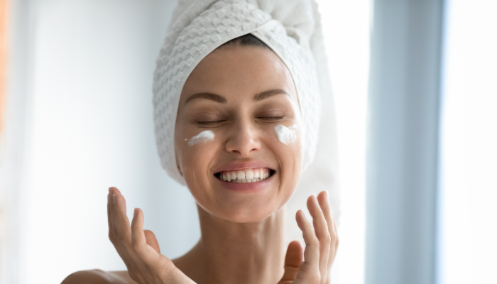 CellDerma Model Smiling Product on Face Content Large Email Banner